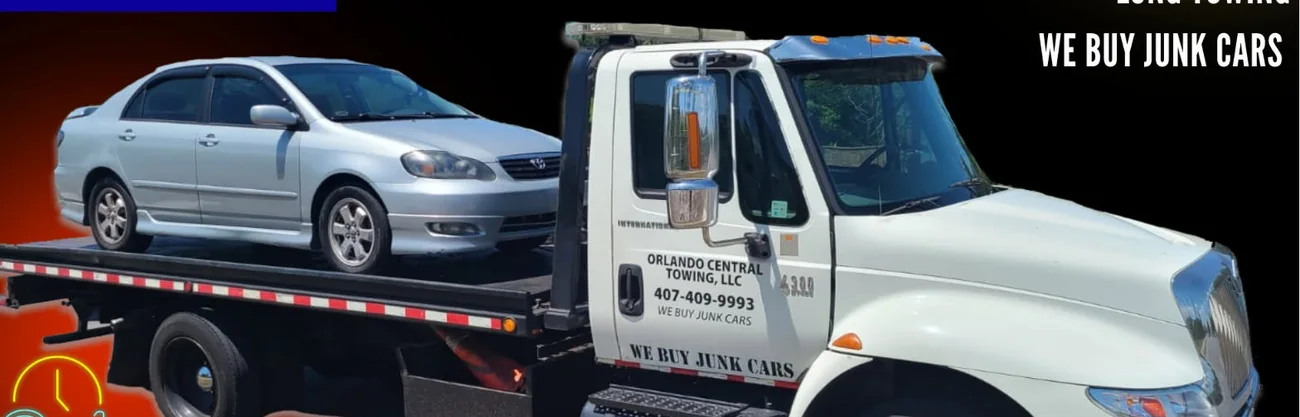 Orlando Central Towing flatbed truck with a car loaded on the deck