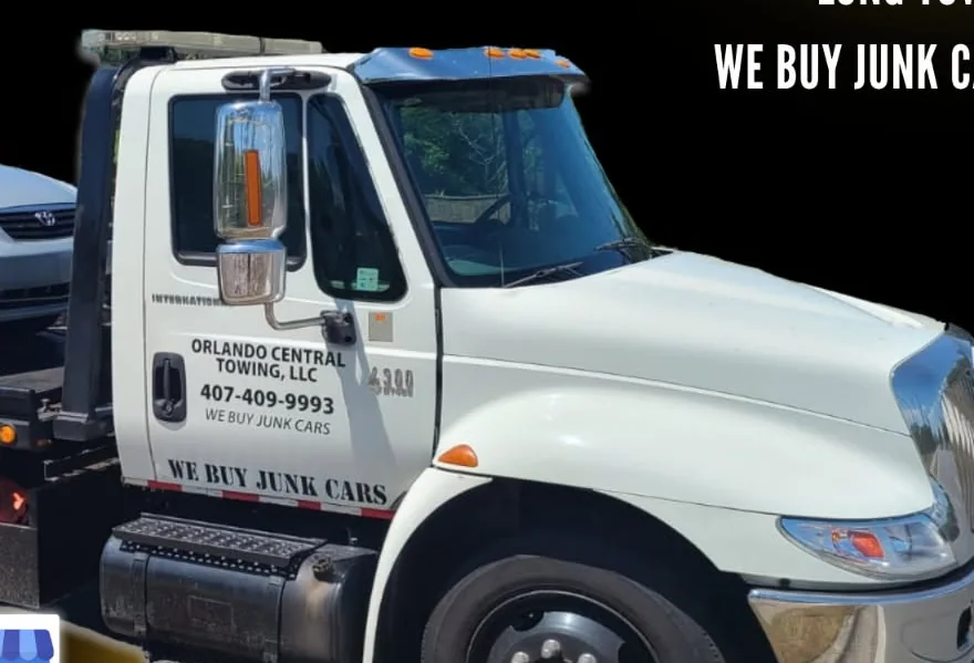 Orlando Central Towing LLC truck cab showing company name and phone number